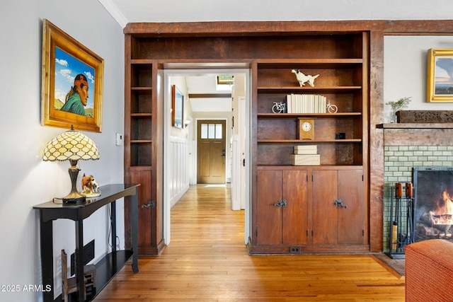 543 S Hassayampa Dr, Prescott, AZ 86303 - hallway with built in shelves, light wood-type flooring, and crown molding