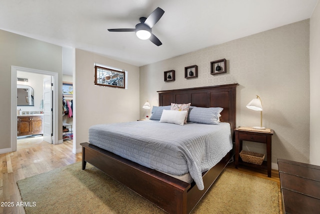 543 S Hassayampa Dr, Prescott, AZ 86303 - bedroom with light wood-type flooring, baseboards, ensuite bath, and ceiling fan
