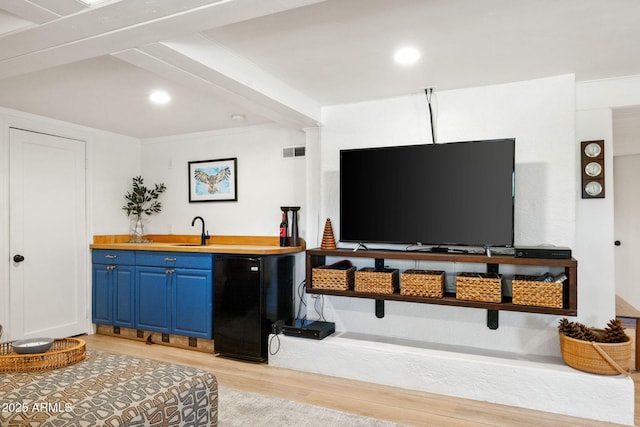 543 S Hassayampa Dr, Prescott, AZ 86303 - indoor wet bar featuring fridge, light wood-style flooring, and recessed lighting