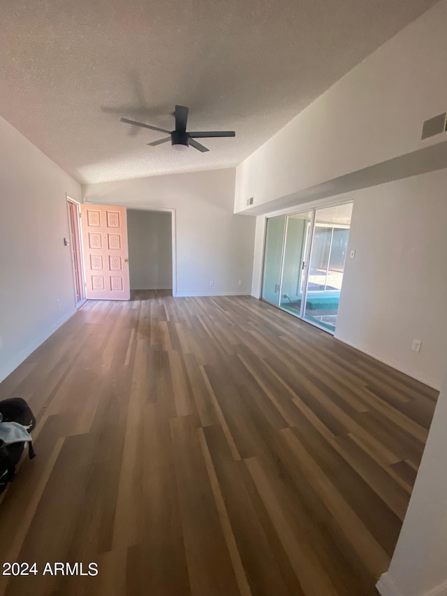 interior space featuring hardwood / wood-style floors, ceiling fan, and a textured ceiling