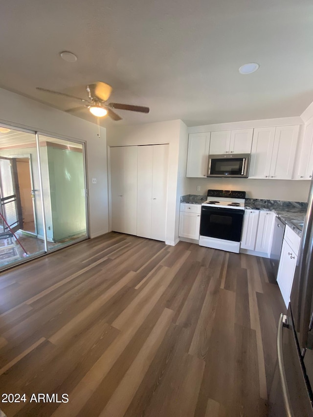 kitchen featuring white cabinets, ceiling fan, dark wood-type flooring, and appliances with stainless steel finishes