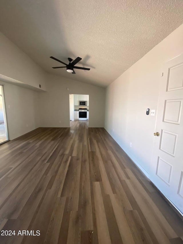 unfurnished living room featuring a textured ceiling, lofted ceiling, ceiling fan, and dark hardwood / wood-style floors