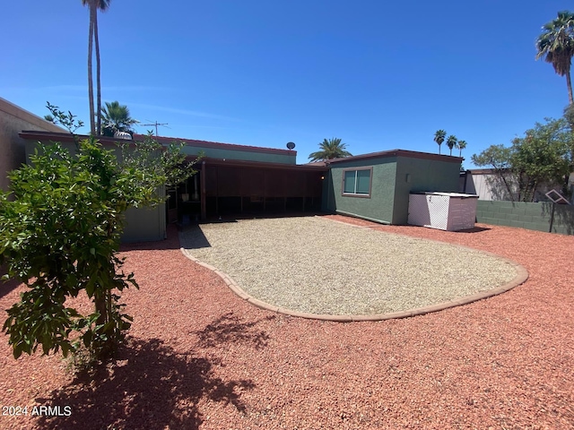 back of property featuring a patio