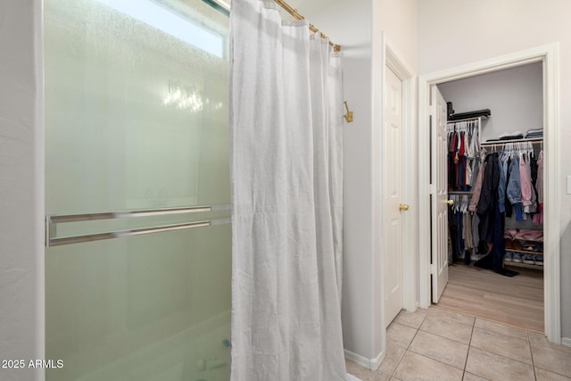 5401 S Dove Holw, Buckeye, AZ 85326 - full bathroom with a shower stall, tile patterned flooring, and a spacious closet