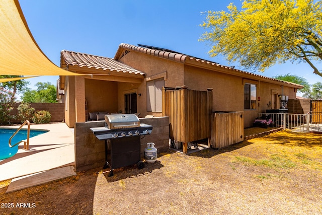 5401 S Dove Holw, Buckeye, AZ 85326 - back of house with a fenced backyard, stucco siding, a patio area, and a tile roof