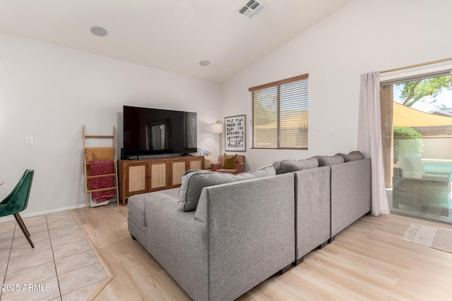 5401 S Dove Holw, Buckeye, AZ 85326 - living area featuring light wood-style floors, high vaulted ceiling, and baseboards