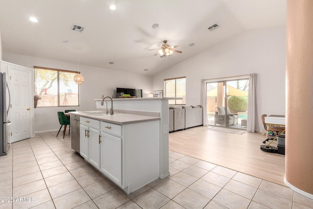5401 S Dove Holw, Buckeye, AZ 85326 - kitchen with a sink, open floor plan, healthy amount of natural light, lofted ceiling, and appliances with stainless steel finishes