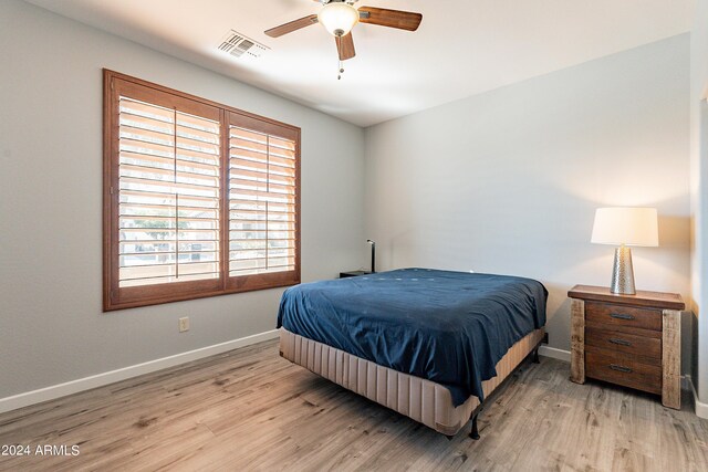 bedroom featuring ceiling fan and light wood-type flooring