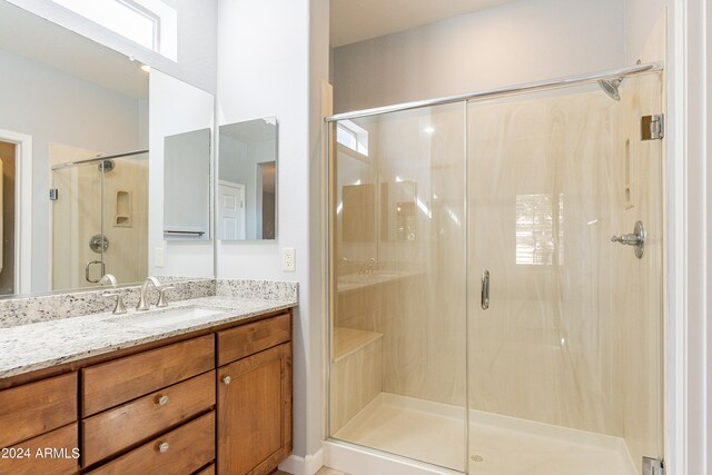 bathroom with vanity and an enclosed shower