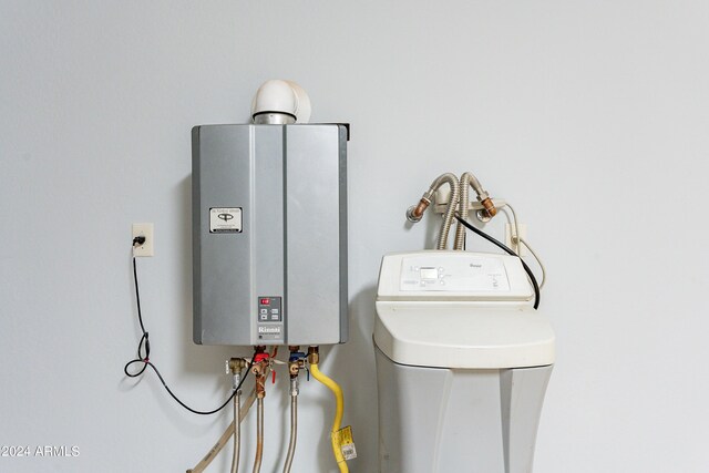 utility room with water heater