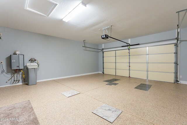 garage with a garage door opener and water heater