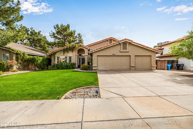 15027 N 61st Pl, Scottsdale, AZ 85254 - view of front of home featuring a front yard, driveway, an attached garage, stucco siding, and a tile roof