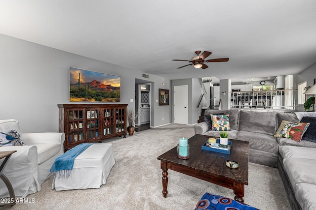 15027 N 61st Pl, Scottsdale, AZ 85254 - carpeted living room featuring stairway, visible vents, and ceiling fan