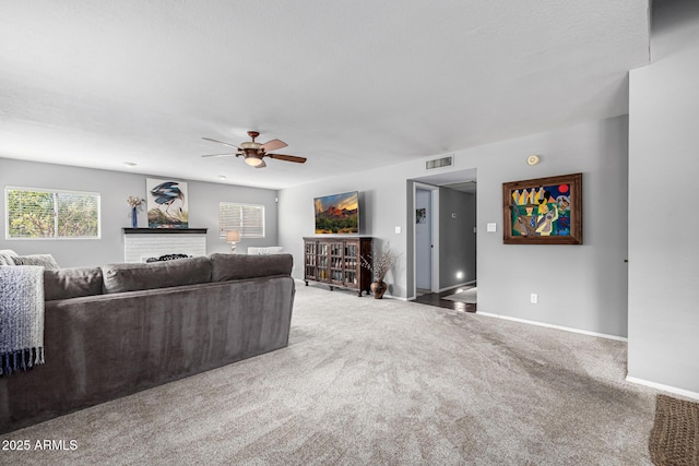 15027 N 61st Pl, Scottsdale, AZ 85254 - carpeted living area with visible vents, baseboards, and a ceiling fan