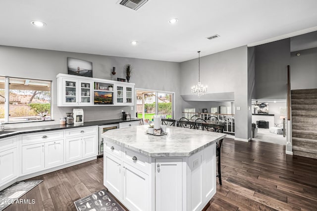 15027 N 61st Pl, Scottsdale, AZ 85254 - kitchen featuring dark wood-type flooring, wine cooler, a notable chandelier, and visible vents