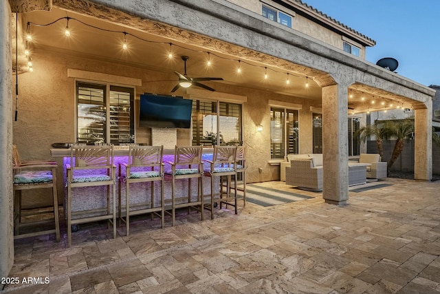 view of patio with outdoor lounge area and a ceiling fan