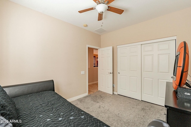 bedroom featuring carpet floors, a closet, a ceiling fan, and baseboards