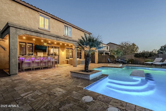 view of swimming pool featuring a fenced backyard, an outdoor hangout area, a fenced in pool, and a patio