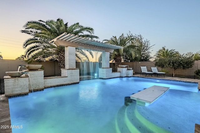 pool at dusk with a fenced in pool and fence