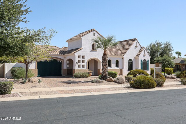 mediterranean / spanish-style house featuring a garage