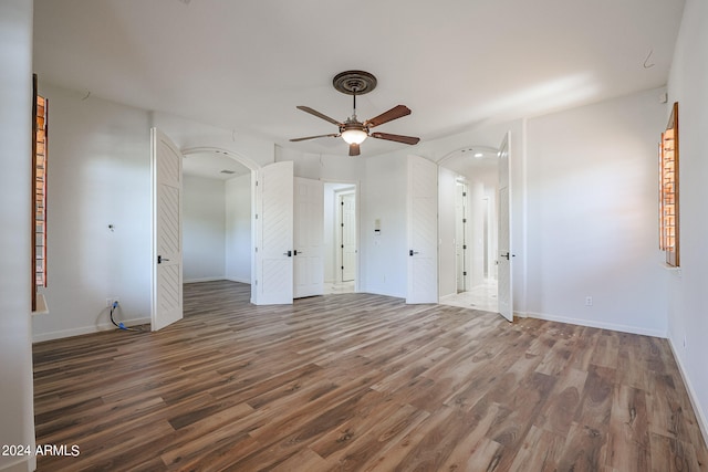 interior space with ceiling fan and hardwood / wood-style floors