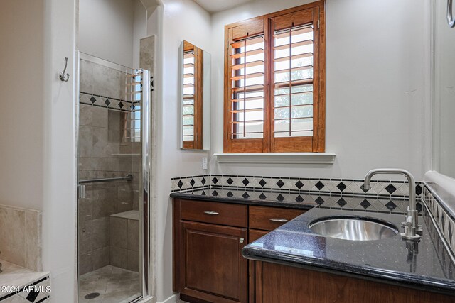 bathroom with an enclosed shower and vanity