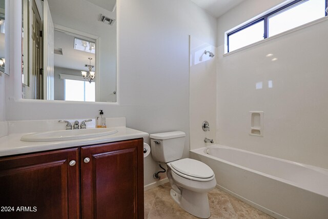 full bathroom with shower / tub combination, vanity, toilet, and an inviting chandelier