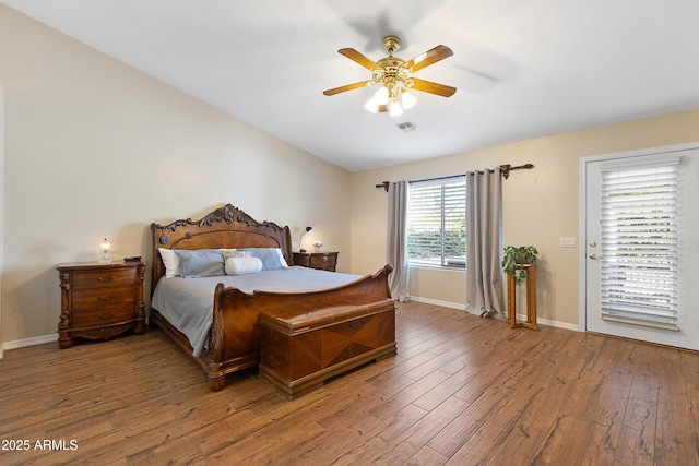 bedroom featuring hardwood / wood-style flooring, lofted ceiling, and ceiling fan