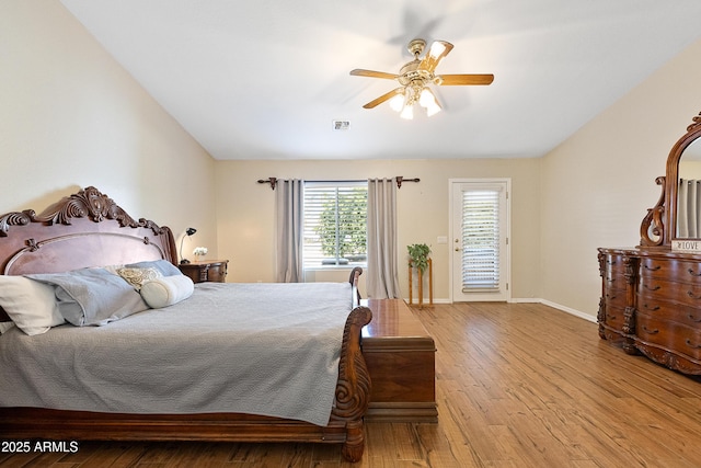 bedroom with light hardwood / wood-style flooring, ceiling fan, and vaulted ceiling