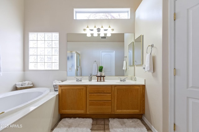 bathroom featuring vanity, independent shower and bath, and tile patterned flooring