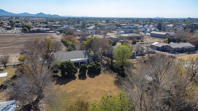 birds eye view of property with a mountain view