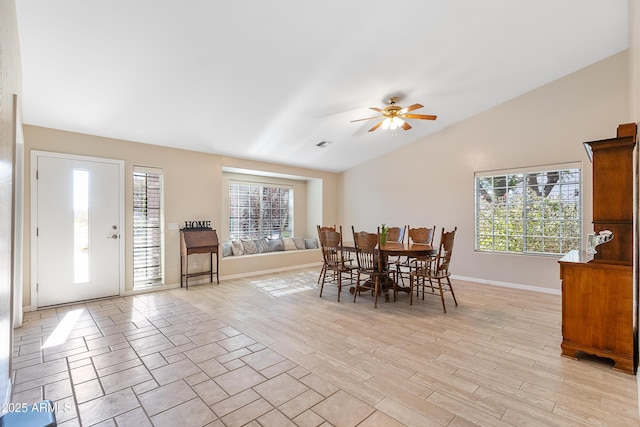 dining area with vaulted ceiling, light hardwood / wood-style floors, and ceiling fan