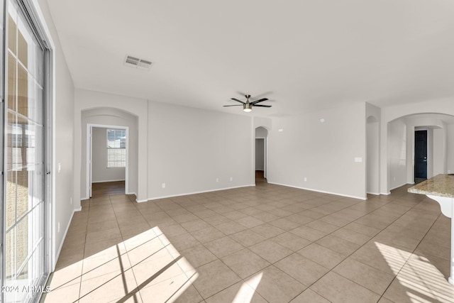 unfurnished room featuring ceiling fan and light tile patterned floors