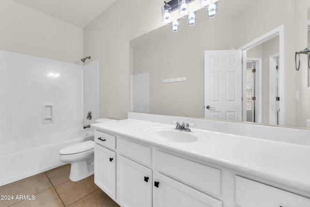 full bathroom featuring tile patterned flooring, vanity, bathing tub / shower combination, and toilet