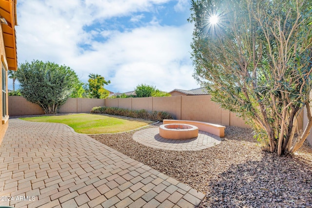 view of yard featuring a patio area and a fire pit