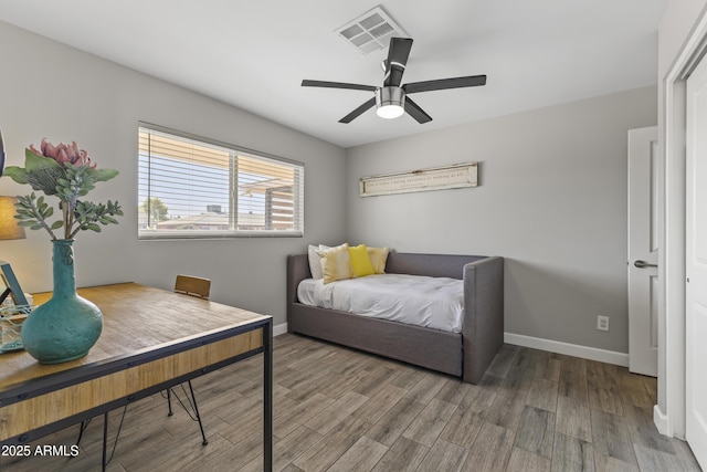 bedroom with hardwood / wood-style flooring and ceiling fan