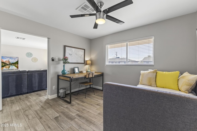 interior space with ceiling fan and light hardwood / wood-style floors