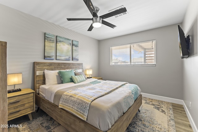 bedroom featuring hardwood / wood-style flooring and ceiling fan