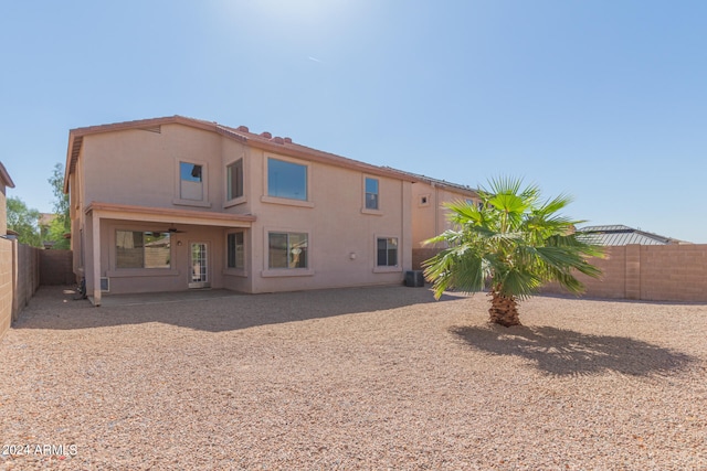 rear view of property featuring a patio, cooling unit, and ceiling fan