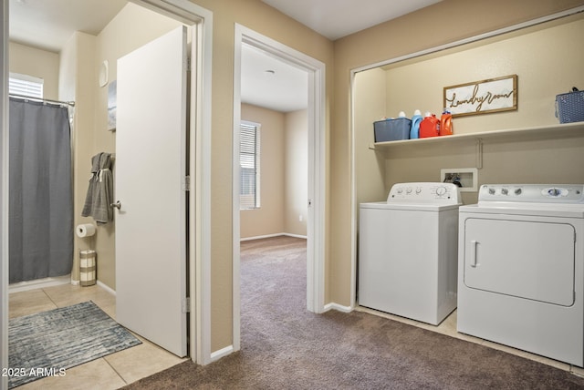 laundry area with independent washer and dryer and light carpet