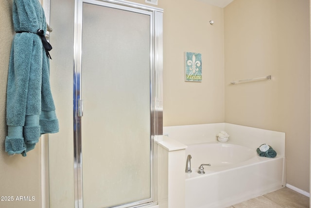 bathroom with tile patterned flooring and independent shower and bath