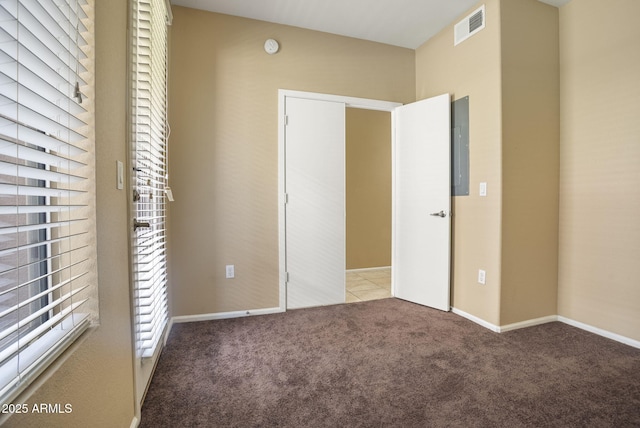 unfurnished bedroom featuring light carpet