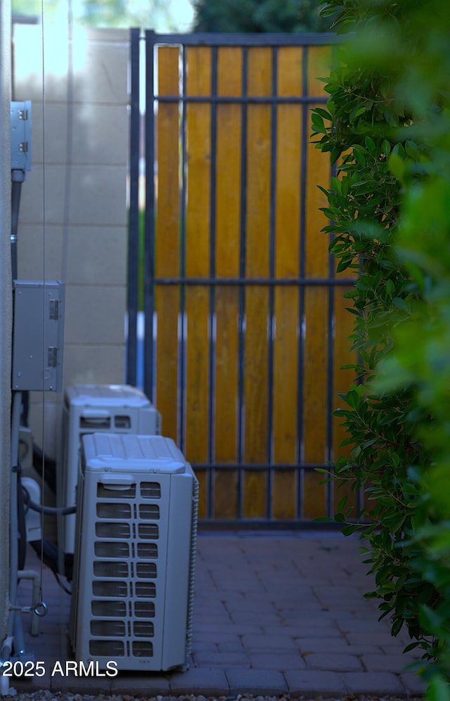 view of gate featuring ac unit