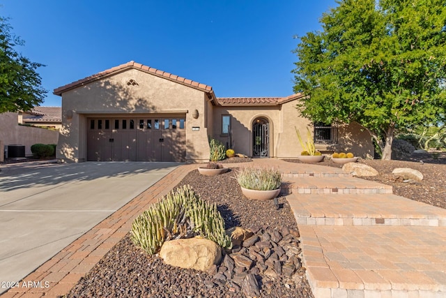 12832 W Pinnacle Vista Dr, Peoria, AZ 85383 - mediterranean / spanish-style home with stucco siding, concrete driveway, an attached garage, a tiled roof, and cooling unit