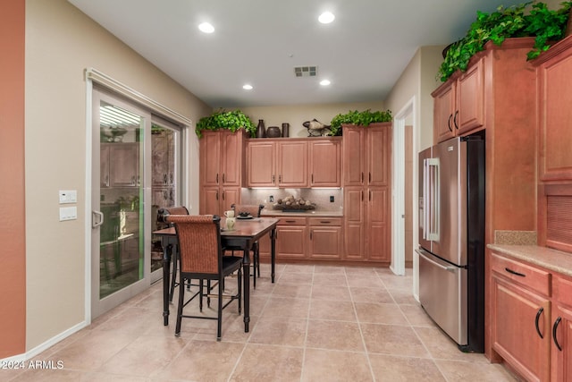 12832 W Pinnacle Vista Dr, Peoria, AZ 85383 - kitchen featuring high end fridge, backsplash, light countertops, recessed lighting, and light tile patterned floors
