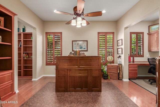 12832 W Pinnacle Vista Dr, Peoria, AZ 85383 - office area with wood finished floors, ceiling fan, baseboards, built in study area, and recessed lighting