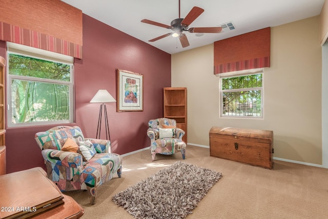12832 W Pinnacle Vista Dr, Peoria, AZ 85383 - sitting room featuring plenty of natural light, carpet flooring, a ceiling fan, and baseboards