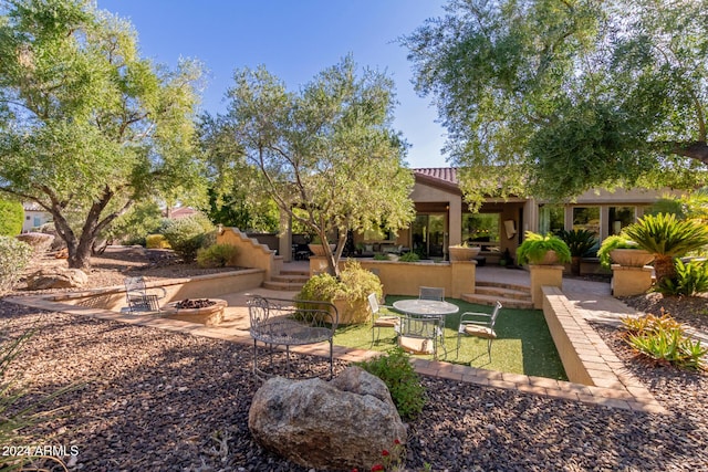 12832 W Pinnacle Vista Dr, Peoria, AZ 85383 - view of yard featuring an outdoor fire pit and a patio area