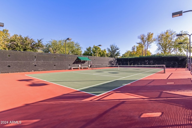 view of sport court featuring basketball hoop