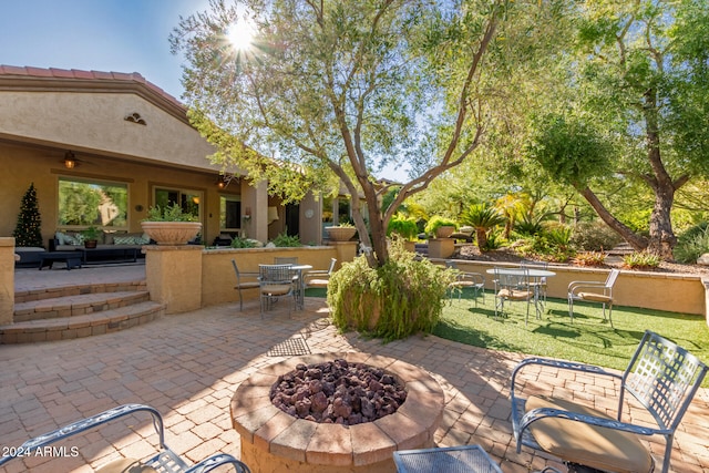 view of patio / terrace featuring a fire pit